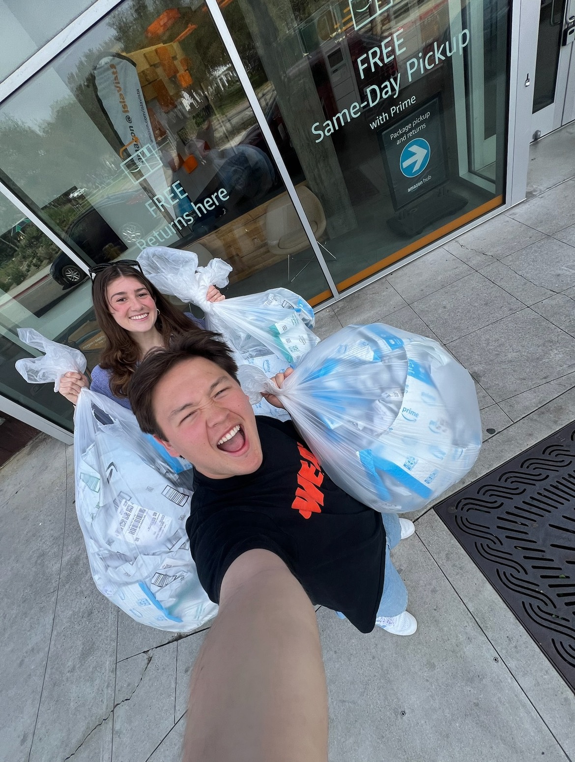 Stephen and Ella collecting bags