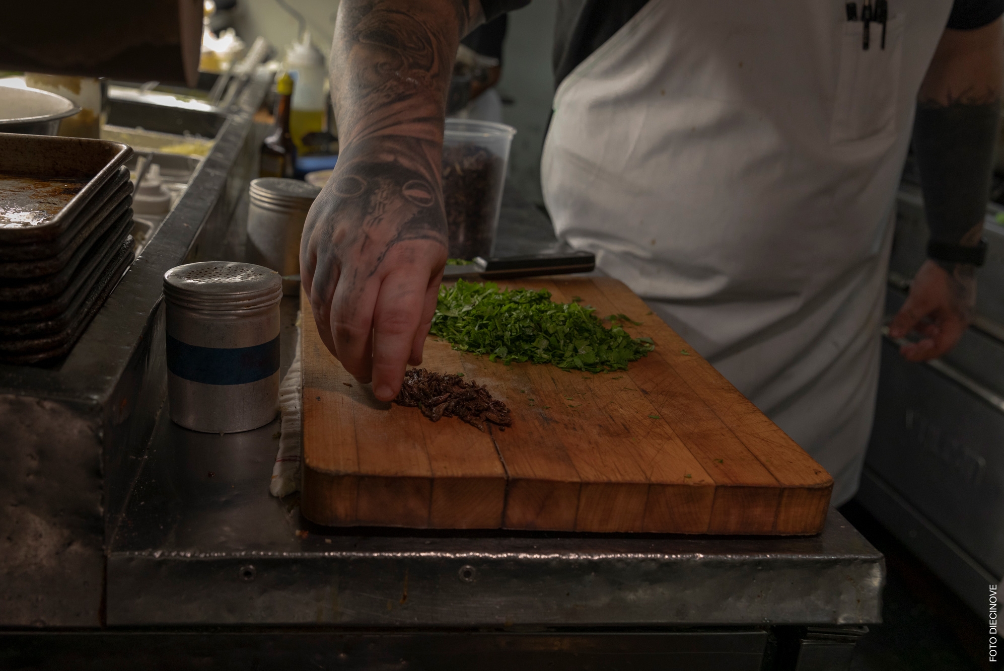 Chef chopping preparing food on a cutting board