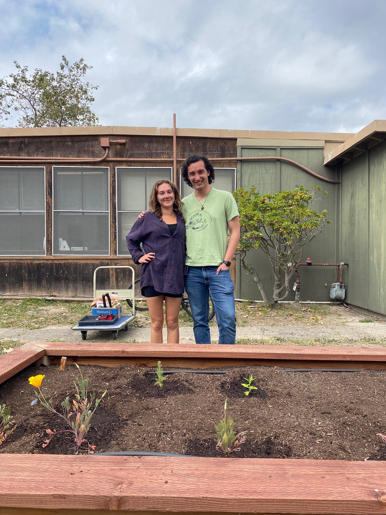 Tanner and Emily planting their native garden study space